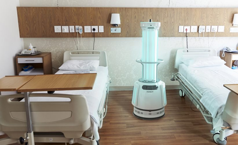 The ADIBOT A1 fully autonomous UV-C disinfection robot disinfecting a patient room at a hospital.